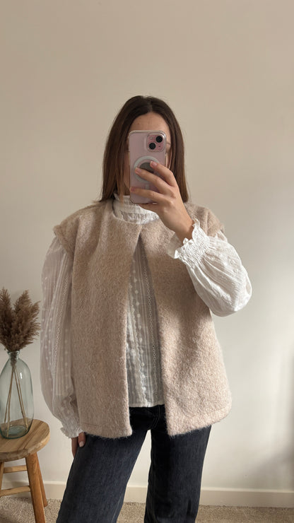 beige sleeveless vest