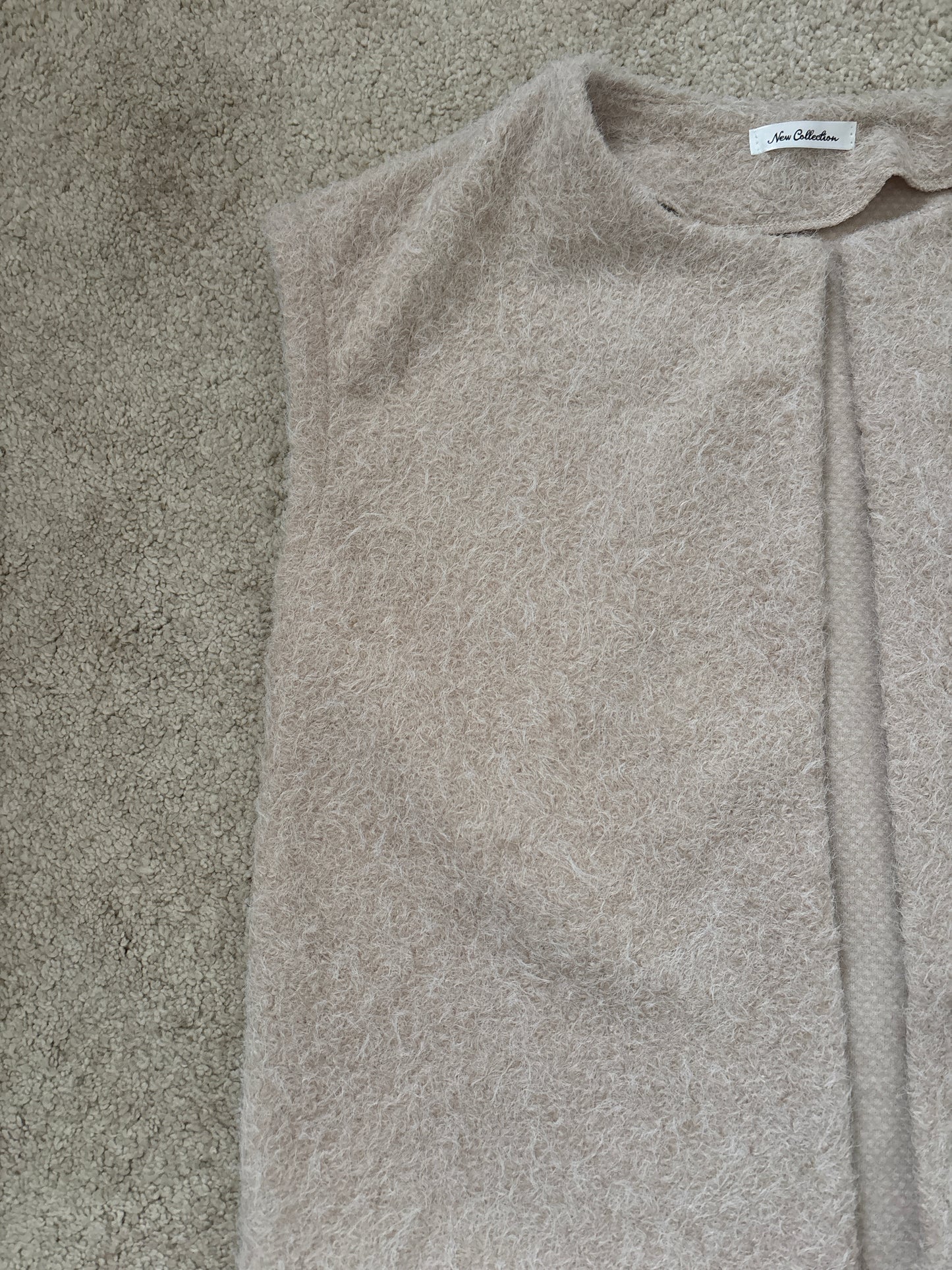 beige sleeveless vest